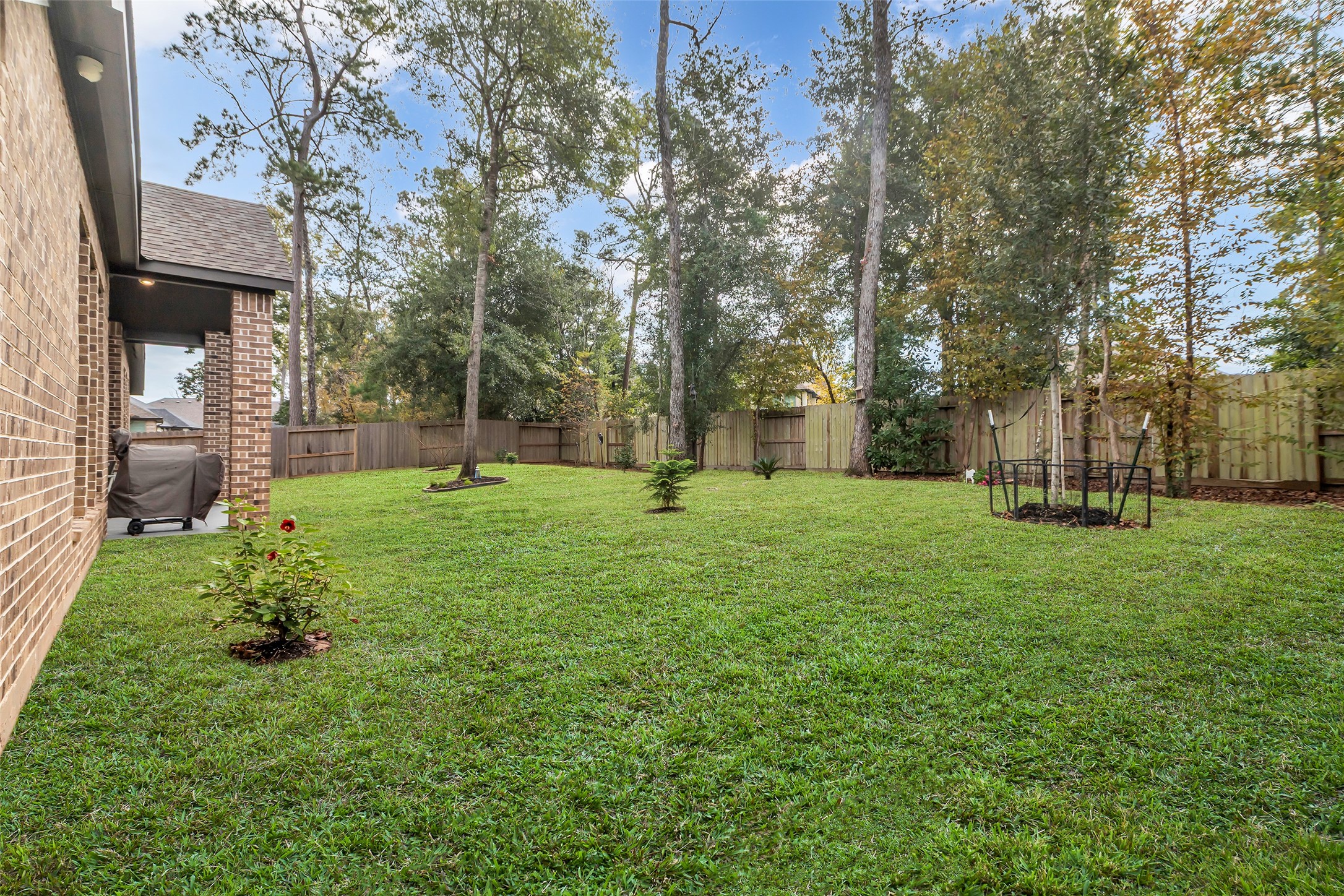 633 North Rivus Overlook Drive Willis, TX 77318 - Photo 26 of 27 Wonderfully landscaped backyard