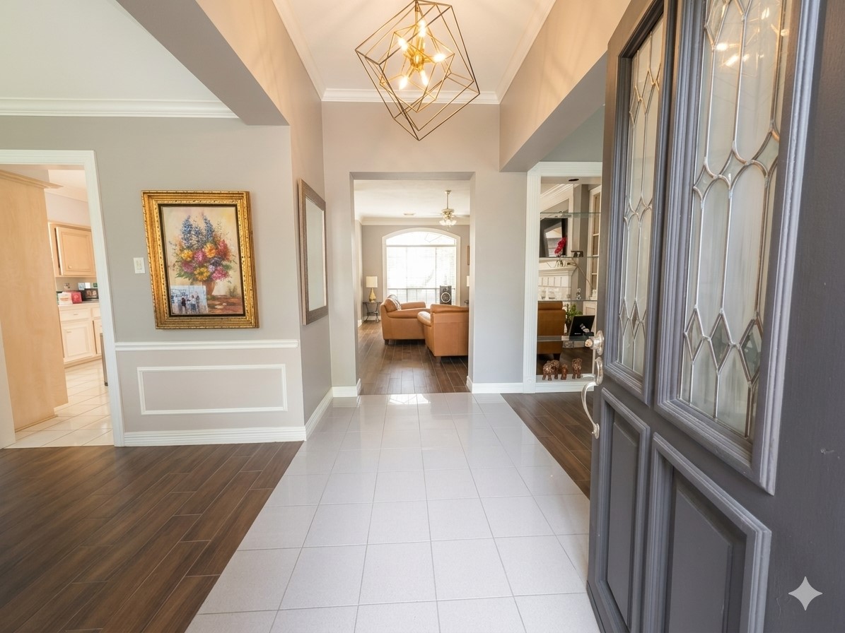 13107 Walnut Lake Road Houston, TX 77065 - Photo 4 of 21 a view of a hallway to a livingroom with furniture