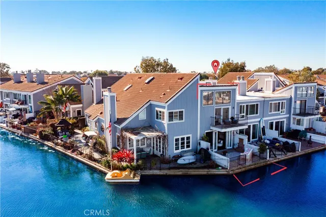 a aerial view of a house with swimming pool and outdoor seating