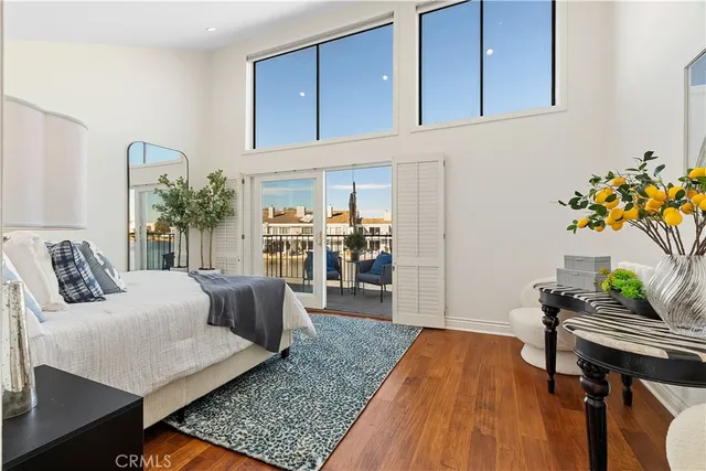 a living room with a couch and a rug
