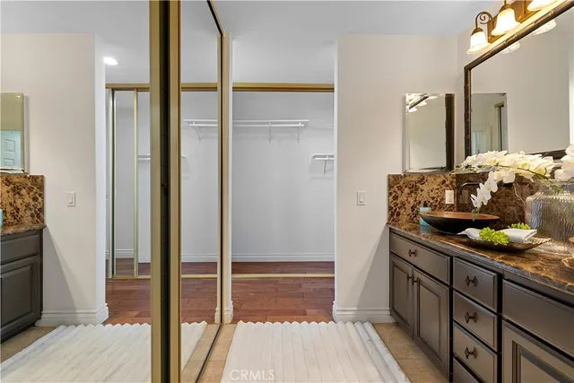 a bathroom with a toilet a sink and a mirror