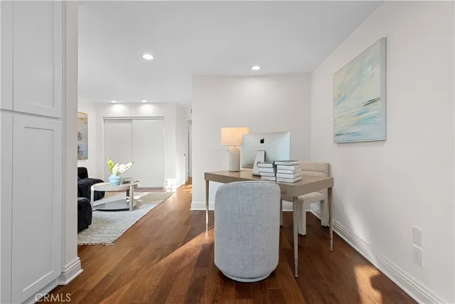 a living room with furniture a fireplace and a potted plant