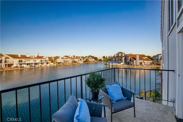 an aerial view of residential houses with outdoor space and swimming pool