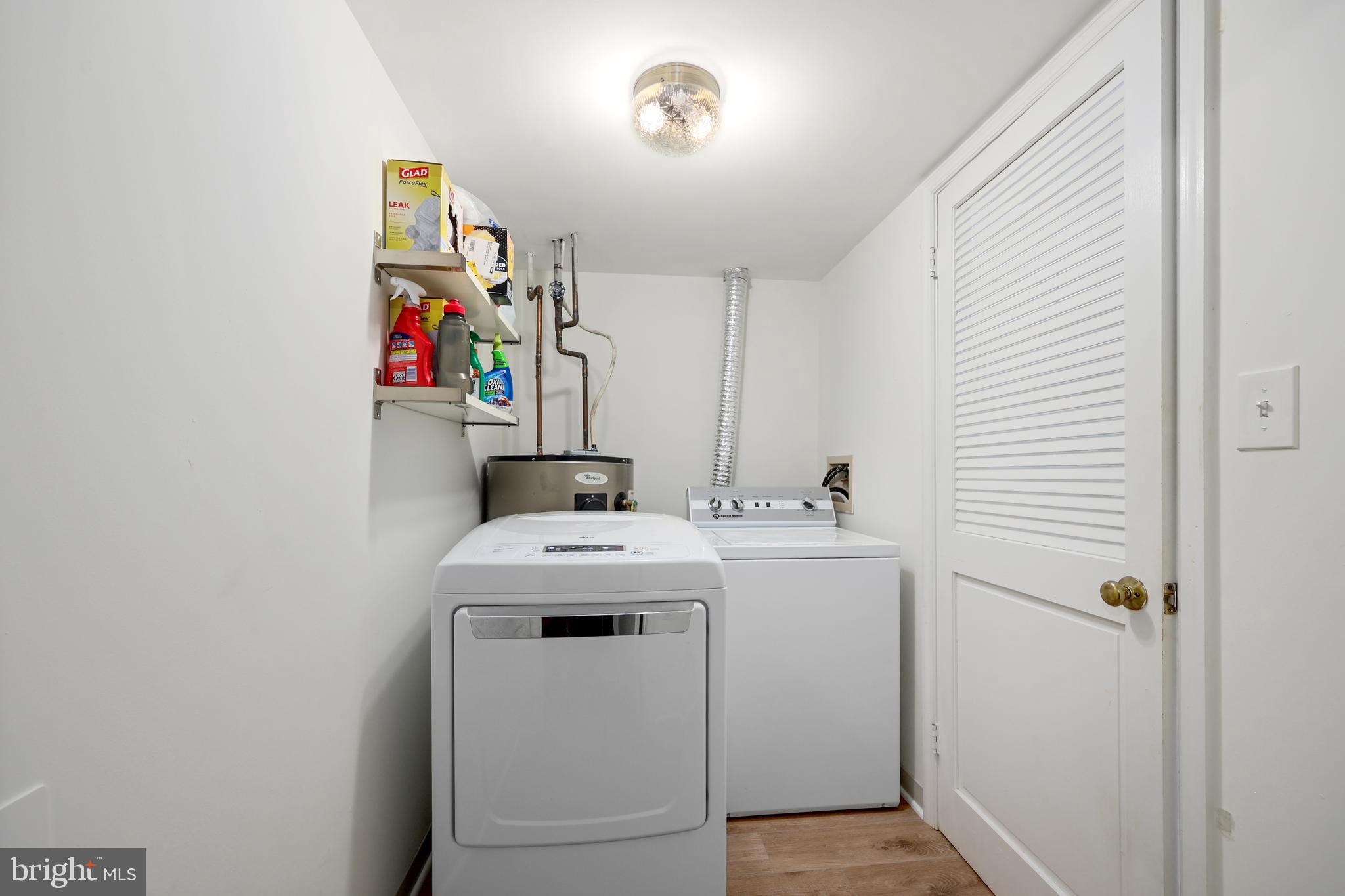 5837 Cove Landing Road, Unit 101 Burke, VA 22015 - Photo 13 of 35 a utility room with dryer and washer