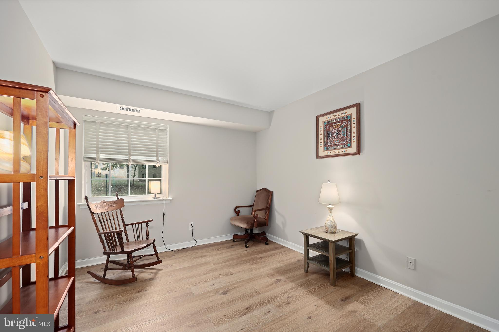 5837 Cove Landing Road, Unit 101 Burke, VA 22015 - Photo 14 of 35 a living room with furniture and a window