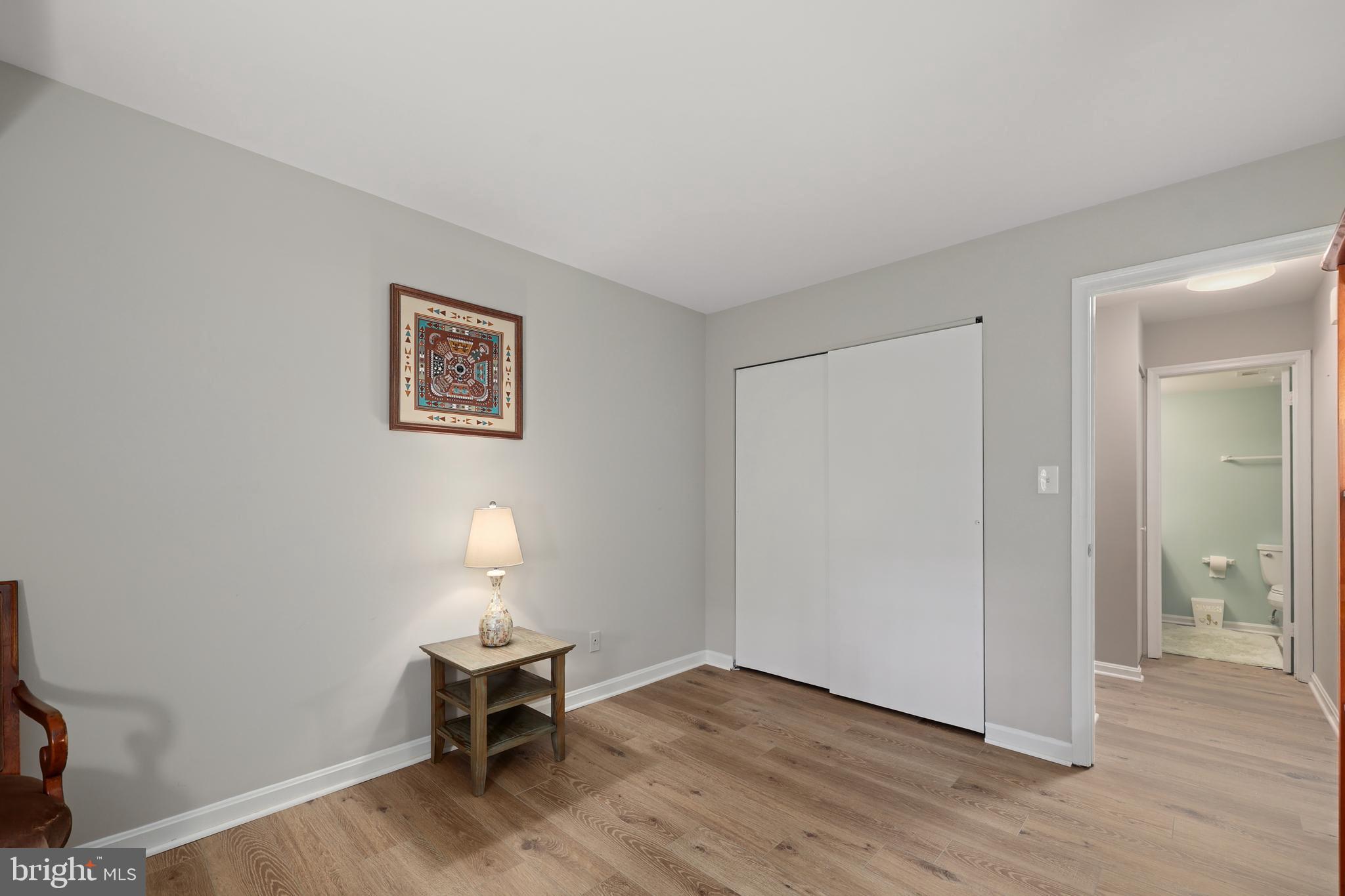 5837 Cove Landing Road, Unit 101 Burke, VA 22015 - Photo 15 of 35 a lamp on a table in a room