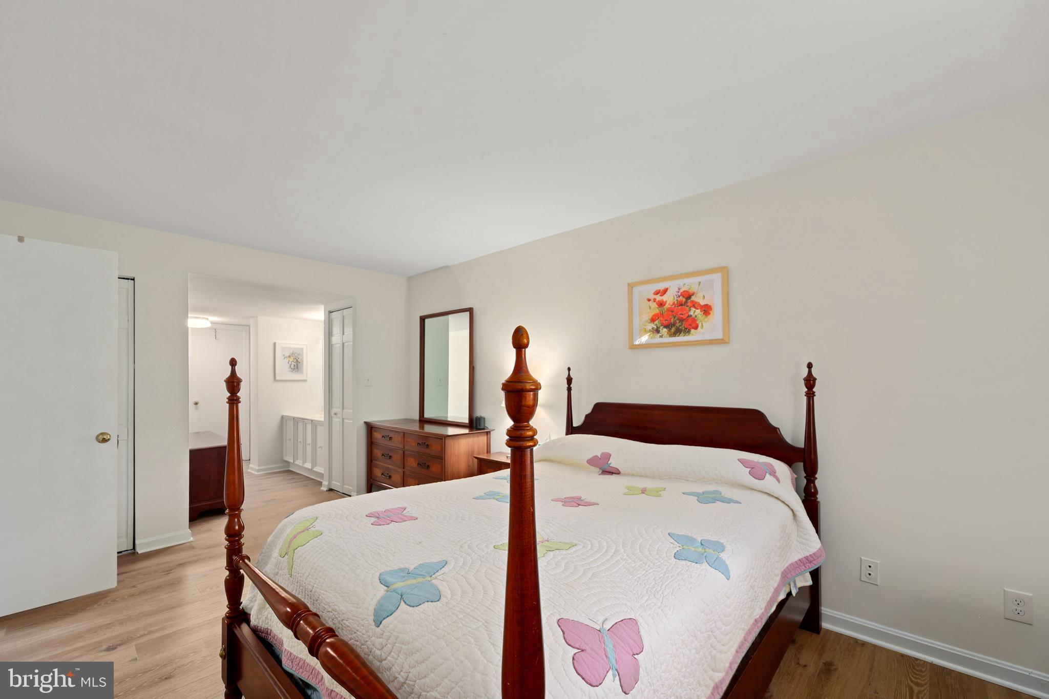 5837 Cove Landing Road, Unit 101 Burke, VA 22015 - Photo 18 of 35 a bed room with a bed and a closet