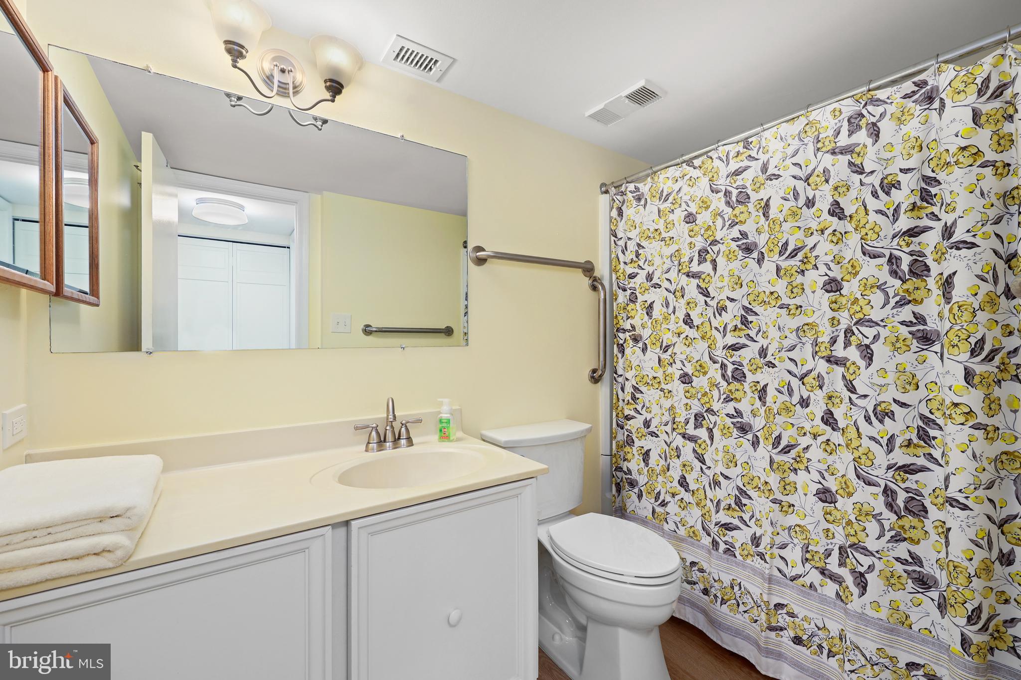 5837 Cove Landing Road, Unit 101 Burke, VA 22015 - Photo 20 of 35 a bathroom with a sink toilet and shower