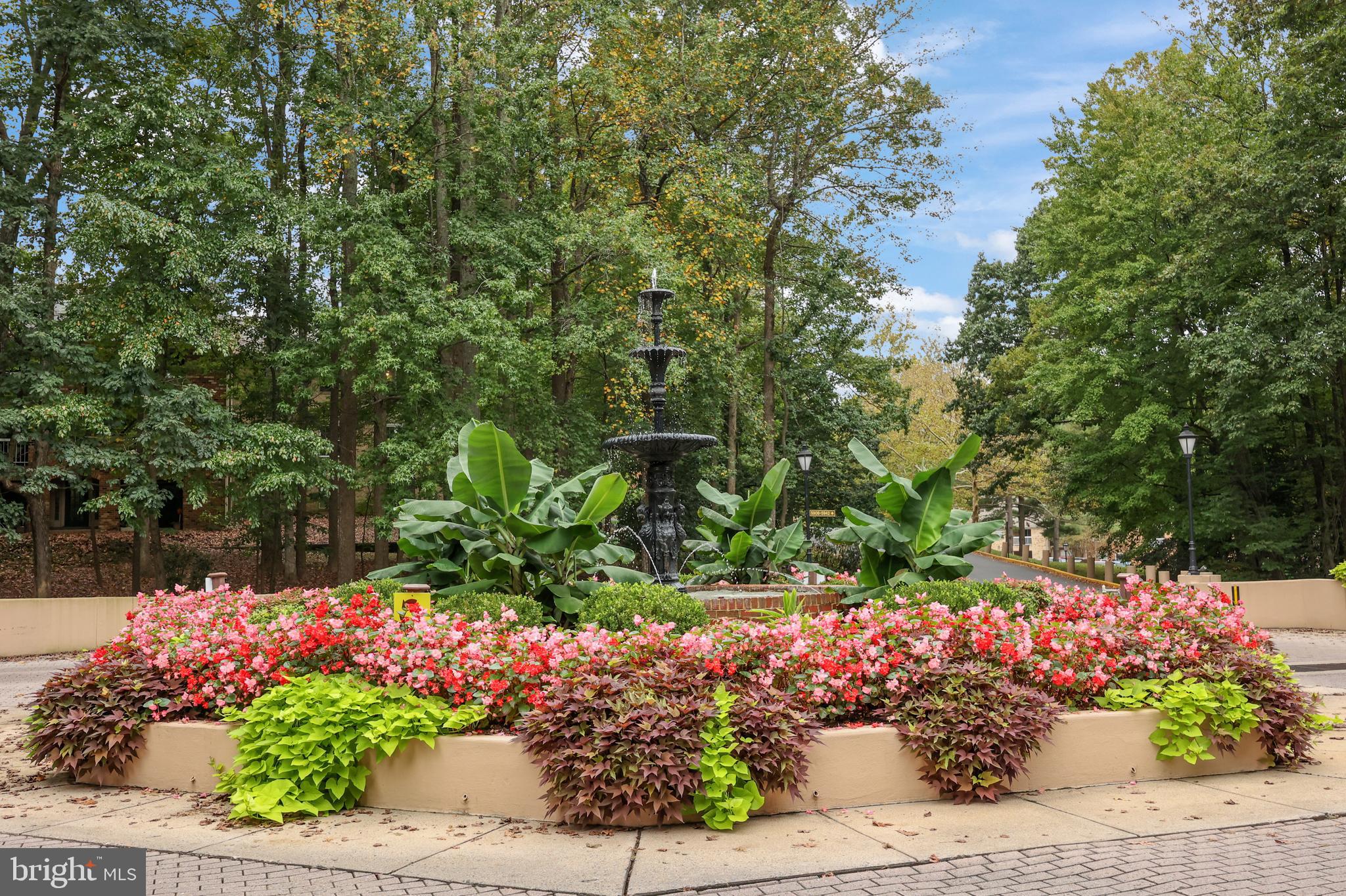 5837 Cove Landing Road, Unit 101 Burke, VA 22015 - Photo 2 of 35 a green field with flowers in the background