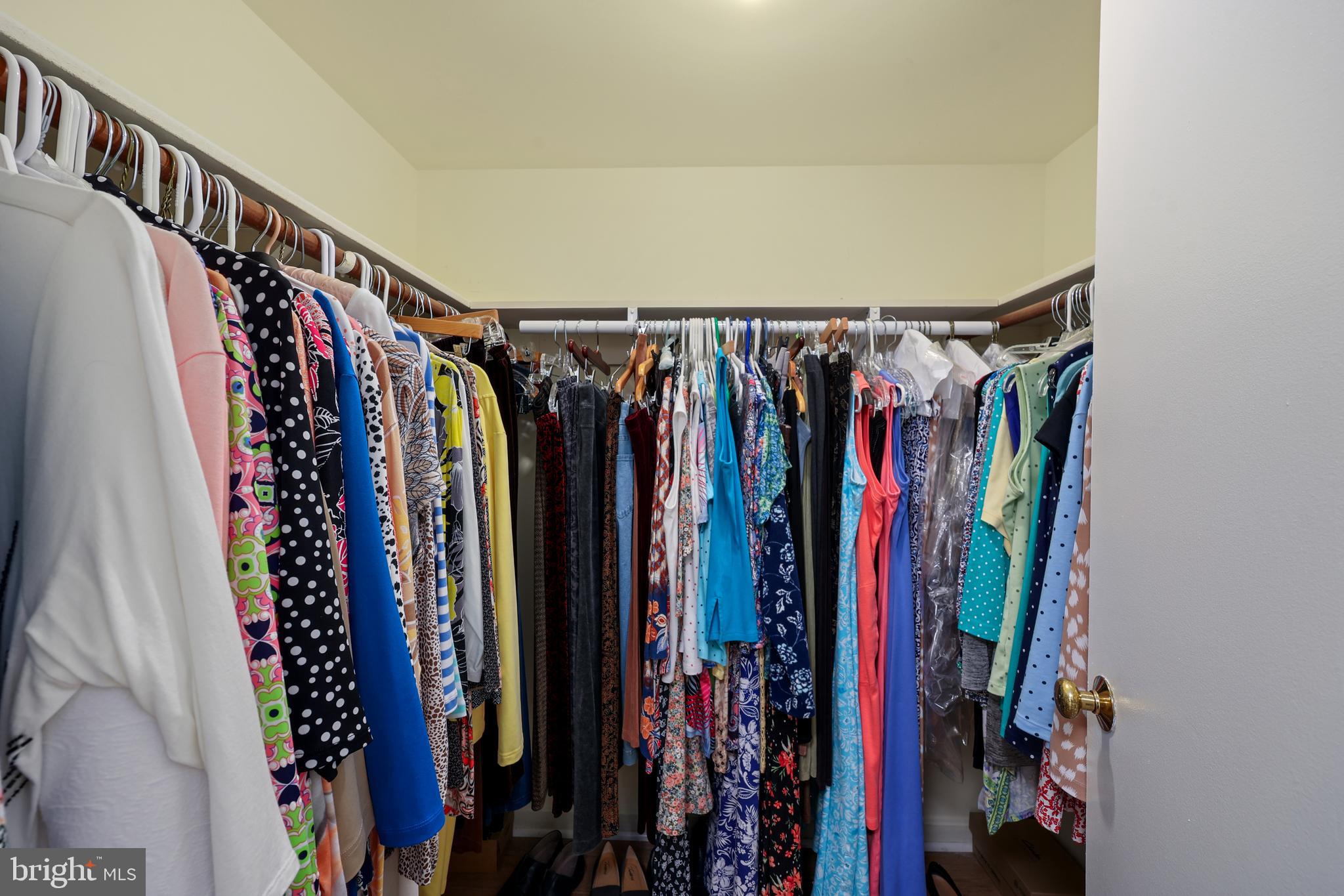 5837 Cove Landing Road, Unit 101 Burke, VA 22015 - Photo 21 of 35 a view of walk in closet with clothes