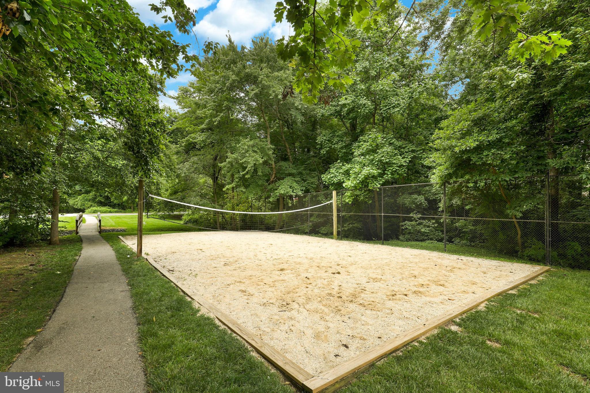 5837 Cove Landing Road, Unit 101 Burke, VA 22015 - Photo 28 of 35 a wooden floor with some trees in the background