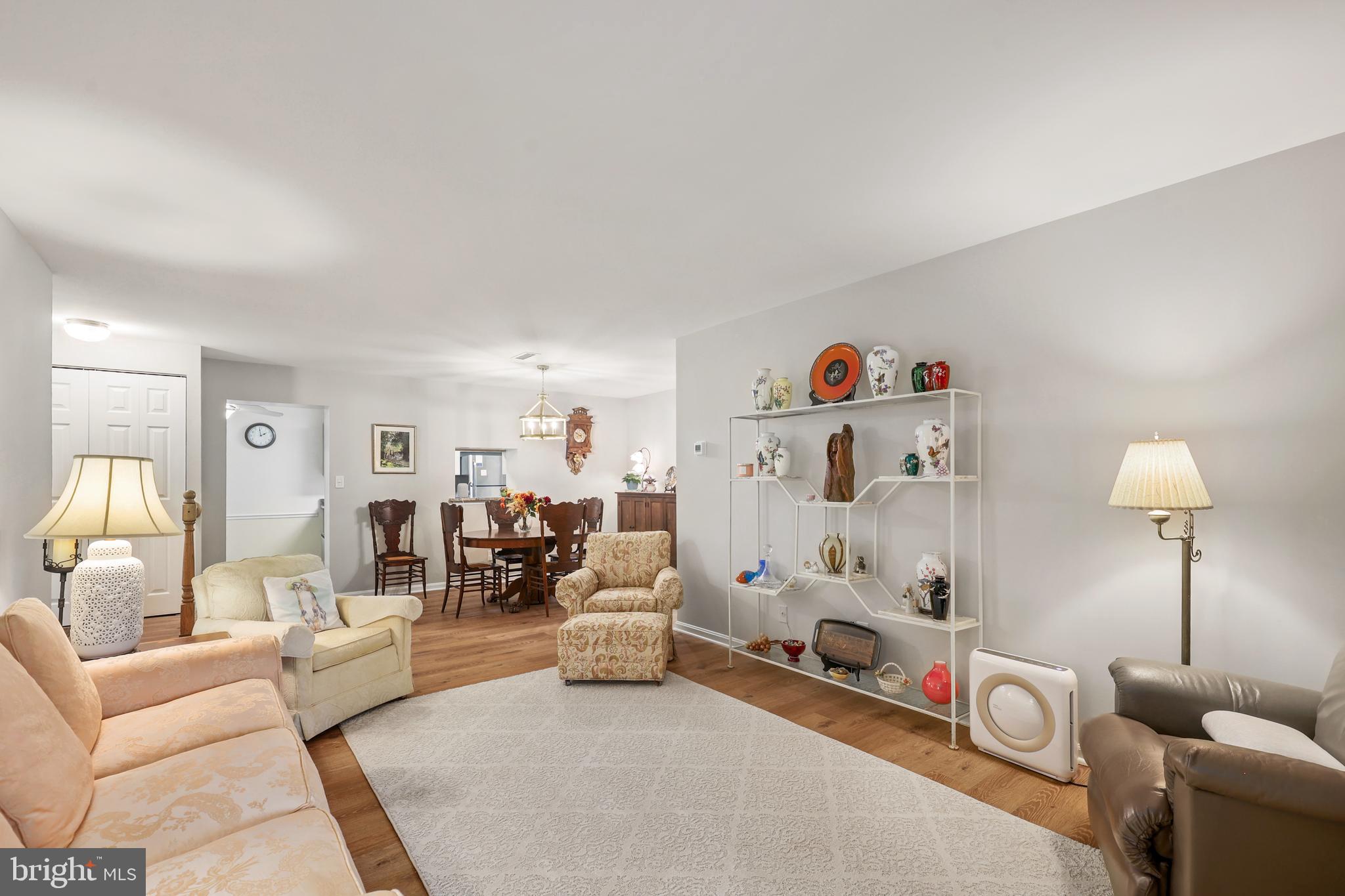 5837 Cove Landing Road, Unit 101 Burke, VA 22015 - Photo 7 of 35 a view of livingroom with furniture and a couch