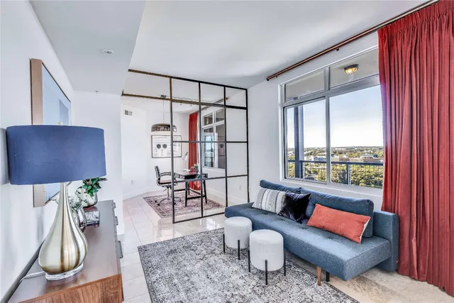 a living room with furniture and a window