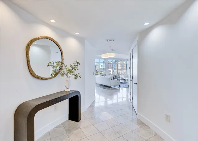 an entryway with a chandelier