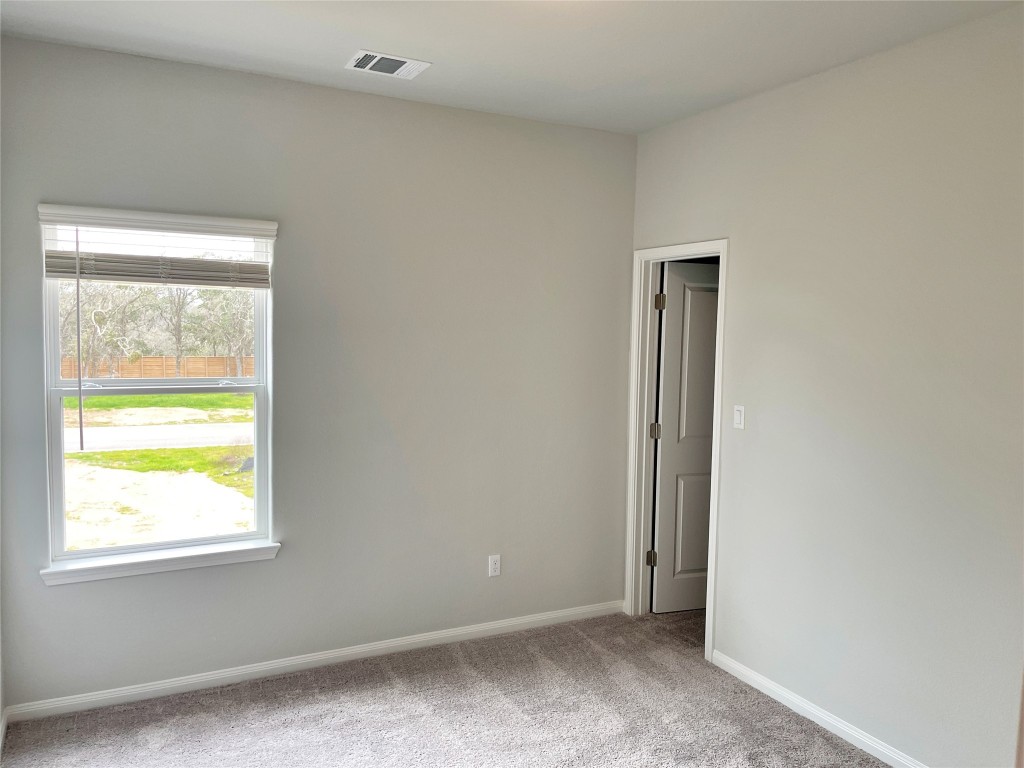 143 Delaware Lane Kyle, TX 78640 - Photo 15 of 30 a view of an empty room and a window