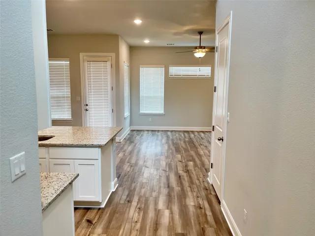 a view of wooden floor and brick walls