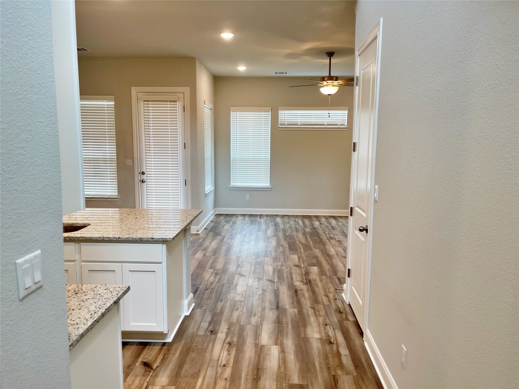 143 Delaware Lane Kyle, TX 78640 - Photo 2 of 30 a view of wooden floor and brick walls