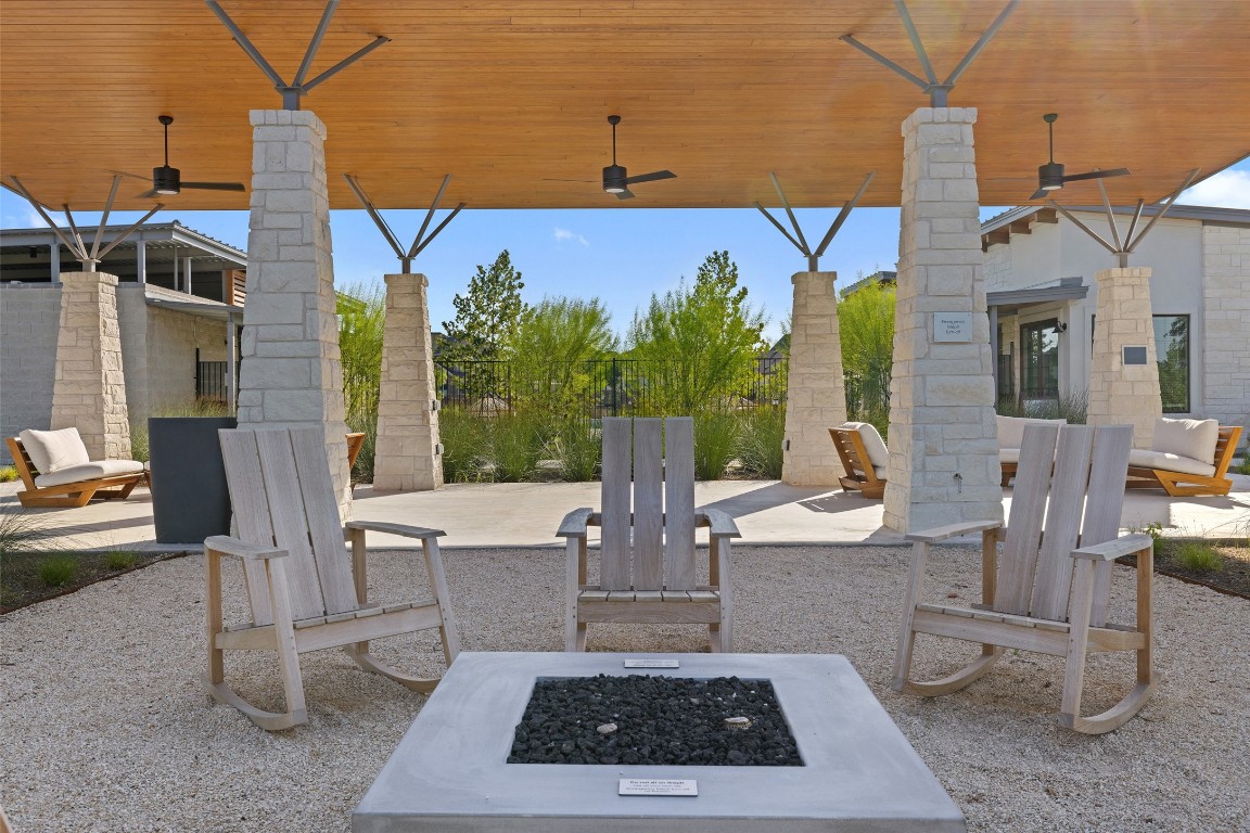143 Delaware Lane Kyle, TX 78640 - Photo 22 of 30 a view of a patio with table and chairs and potted plants