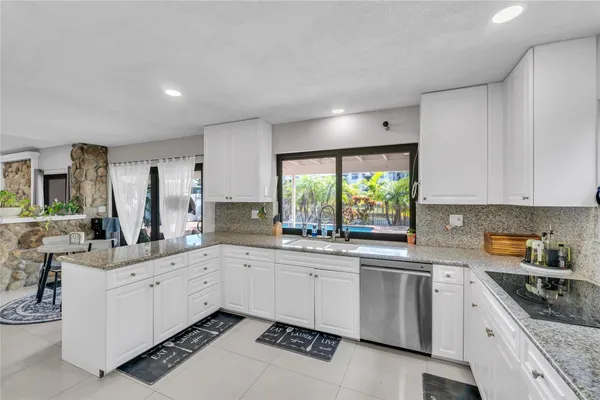 a kitchen with sink and window