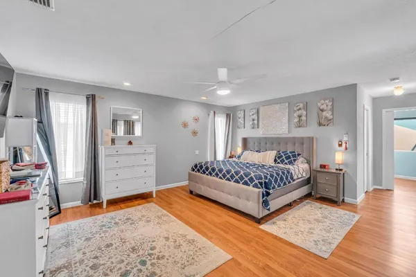 a bedroom with a bed and dresser