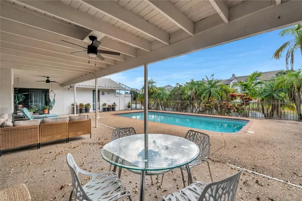 a view of a swimming pool with a patio