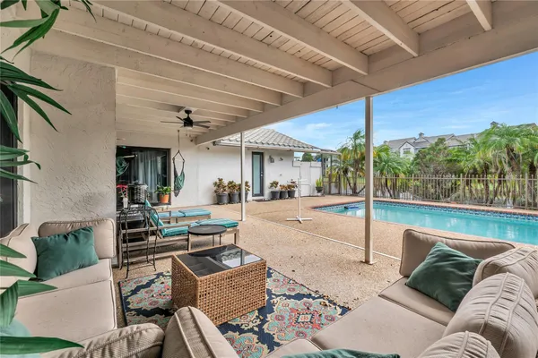 a view of a patio with couches chairs and a table