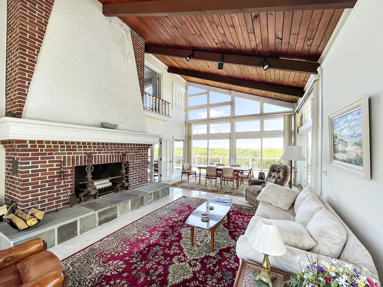 70 Capawock Road West Tisbury, MA 02568 - Photo 11 of 23 a living room with furniture windows and a fireplace