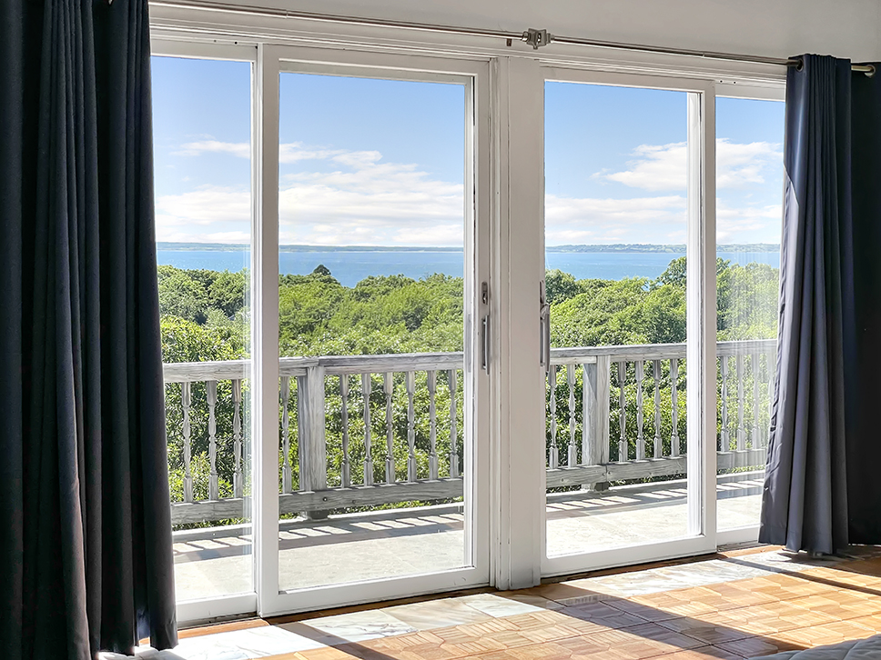 70 Capawock Road West Tisbury, MA 02568 - Photo 13 of 23 a view of a room that has a bed and wooden floor