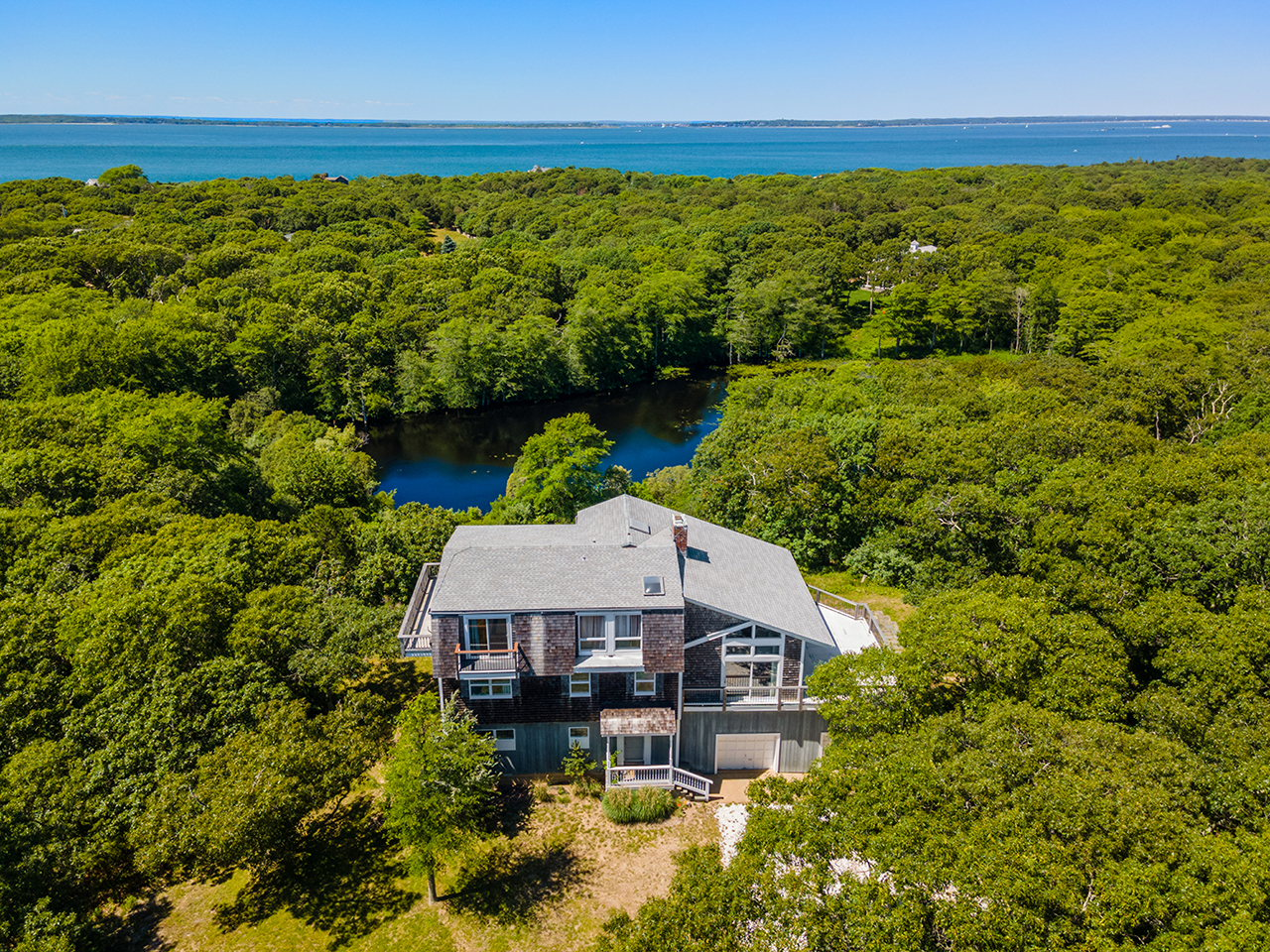 70 Capawock Road West Tisbury, MA 02568 - Photo 5 of 23 a aerial view of a house with a yard