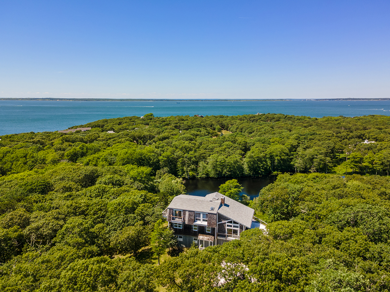 70 Capawock Road West Tisbury, MA 02568 - Photo 7 of 23 a view of a city with ocean view
