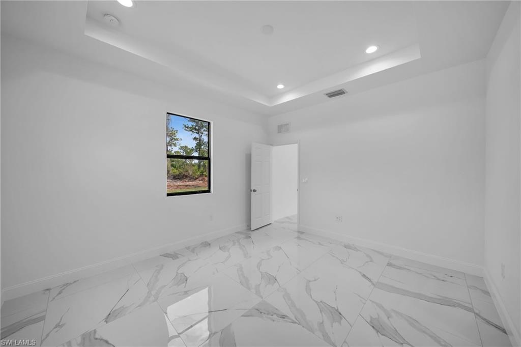 3804 40th Street Southwest Lehigh Acres, FL 33976 - Photo 13 of 24 en empty room with windows