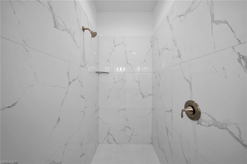 3804 40th Street Southwest Lehigh Acres, FL 33976 - Photo 16 of 24 a bathroom with a shower