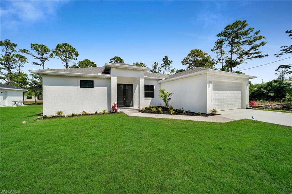 3804 40th Street Southwest Lehigh Acres, FL 33976 - Photo 24 of 24 a front view of house with yard