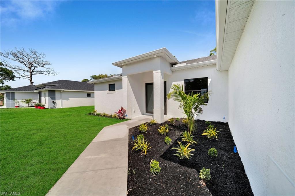 3804 40th Street Southwest Lehigh Acres, FL 33976 - Photo 3 of 24 a view of house with a yard