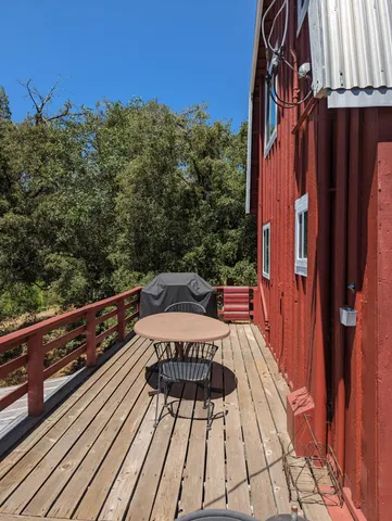 a view of balcony with furniture