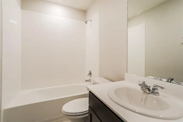 a bathroom with a sink toilet and a bathtub