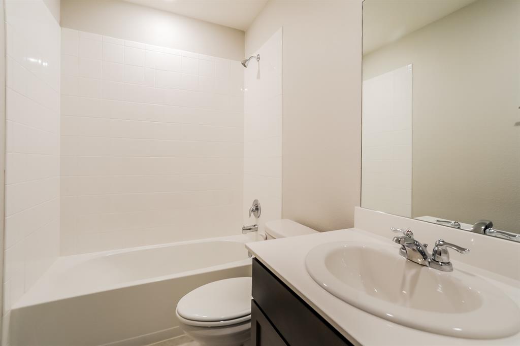 3113 Parsons Street Fate, TX 75189 - Photo 12 of 15 a bathroom with a sink toilet and a bathtub