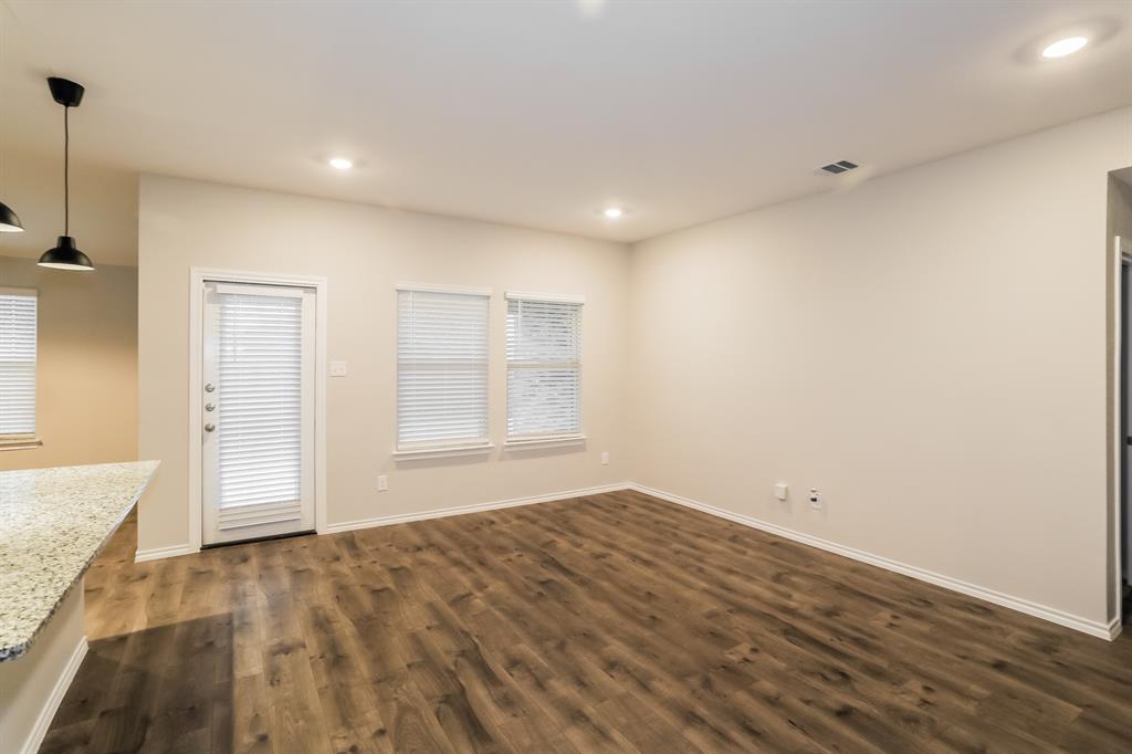 3113 Parsons Street Fate, TX 75189 - Photo 4 of 15 a view of empty room with wooden floor and fan