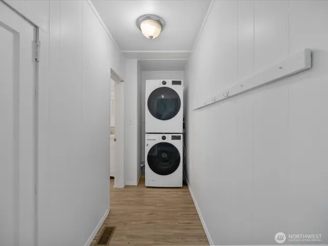 a view of a hallway with washer and dryer