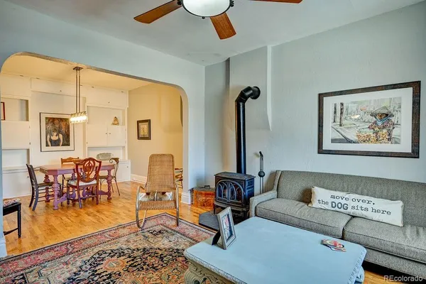 a kitchen with a refrigerator a sink and white cabinets