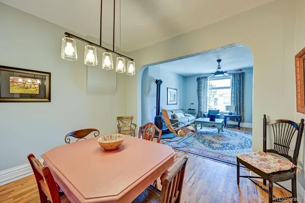 a bedroom with a bed and a flat tv screen on the dresser