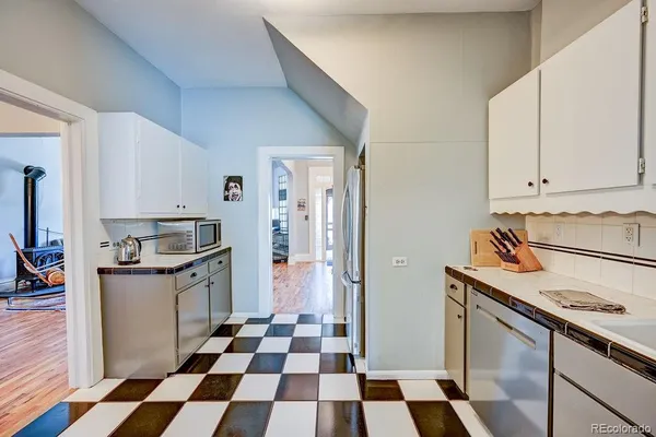 a view of a storage and utility room with washer and dryer