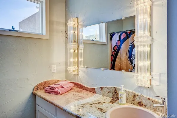 a view of a hallway with wooden floor and closet