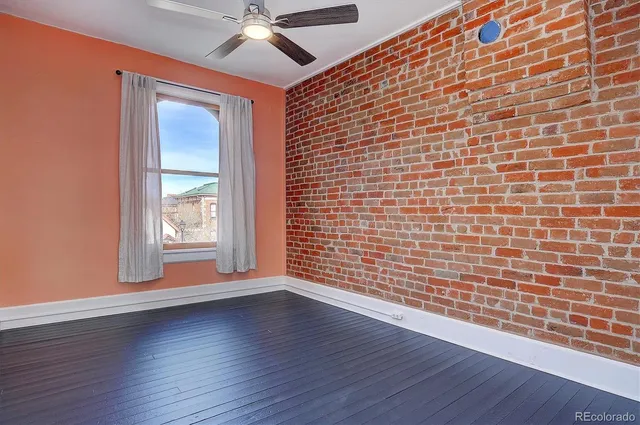 a view of a large house with a large tree