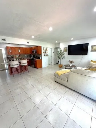 a bathroom with a granite countertop toilet sink and shower