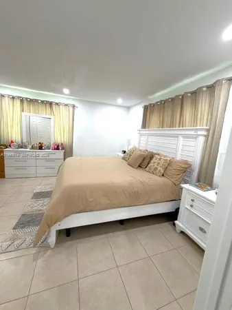 a bedroom with a bed and a shower