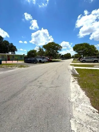 a view of a swimming pool with a yard
