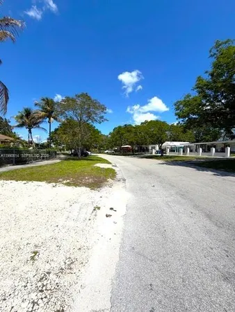 a view of an swimming pool with an outdoor space and seating area
