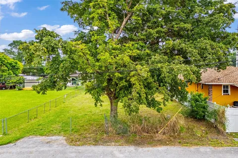a view of a yard with an outdoor space