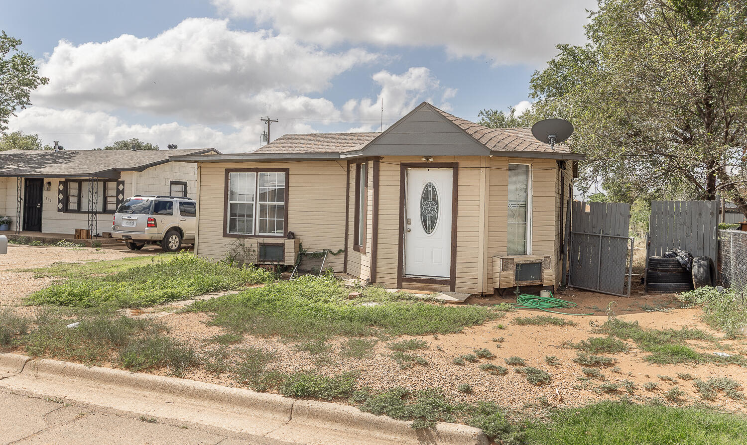 521 46th Street Lubbock, TX 79404 - Photo 9 of 10 a front view of a house with a yard